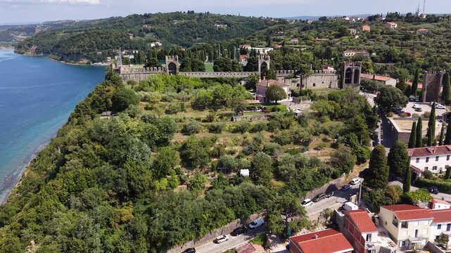 Drone shot of historic town walls overlooking Piran city, Slovenia