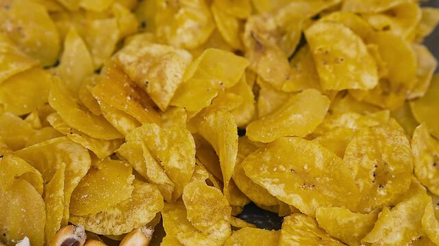Crispy Peruvian plantain chips chifles fried plantain chips in a bowl.