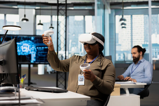 Software developer uses virtual reality technology and AI scripts to automate repetitive tasks, wearing VR equipment while accelerating software feature implementation for a technology company.