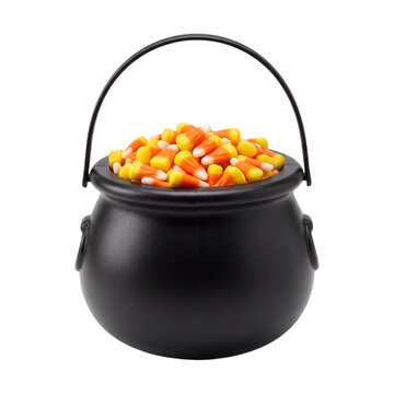 Black cauldron filled with candy corn isolated on transparent background