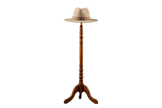 Tall dark wooden hat stand displaying a beige fedora