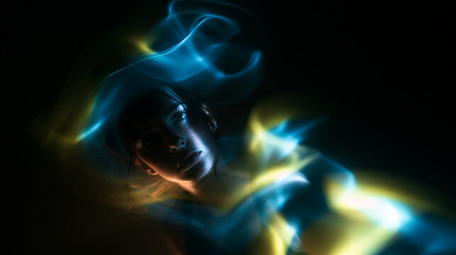 Futuristic Portrait of Woman Surrounded by Glowing Light Trails