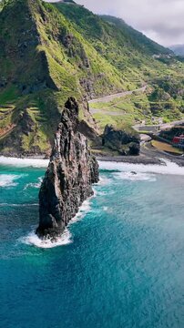 Atlantic Ocean coastline of Madeira Island featuring large sea stacks and rugged coastal rock formations
