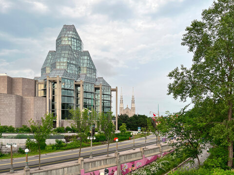 Modern glass pyramid tower of National Gallery of Canada in Ottawa as seen from Majors Hill Park, June 2026