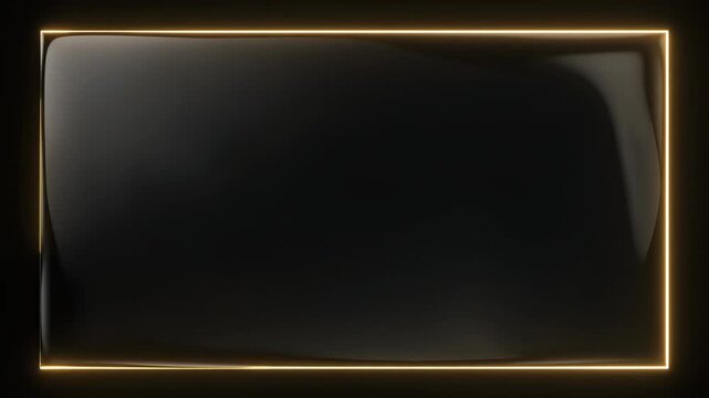 黒いガラス板の縁を金色の光の線がゆっくり縁取っていく動画素材