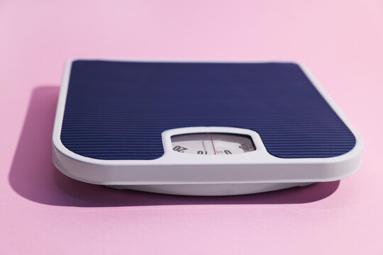 One floor scales on pink background, closeup