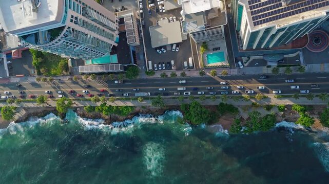 Aerial view of George Washington Avenue along the Caribbean Sea coastline with modern high-rise buildings and traffic in Santo Domingo, Distrito Nacional, Dominican Republic.
