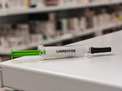LANREOTIDE somatostatin analogue for neuroendocrine and hormonal disorders in a prefilled syringe on pharmacy shelf with blurred background