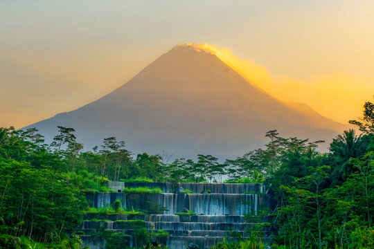 Lush forest and waterfall in front of Mt Merapi, Central Java, Indonesia
