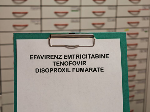 EFAVIRENZ EMTRICITABINE TENOFOVIR DISOPROXIL FUMARATE medication name displayed on a clipboard in a pharmacy healthcare concept