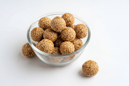 Til ke laddu sesame seed sweet balls in glass bowl