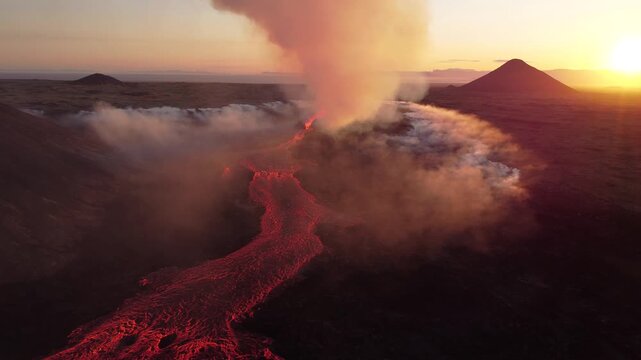 Aerial view of the Litli-Hrutur volcanic eruption with glowing lava flows and volcanic smoke rising into the sky at sunset in Grindavik, Grindavikurbaer, Iceland.