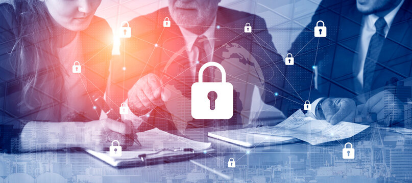Business professionals work together on data security strategies in a modern office with digital lock graphics, emphasizing collaboration and innovation in protecting sensitive information. Gantry