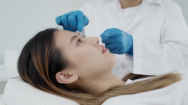 plastic surgery, beauty, Surgeon or beautician touching woman face, surgical procedure that involve altering shape of nose, doctor examines patient nose before rhinoplasty, medical assistance, health