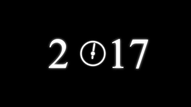numbers 2017 with three clock faces integrated into the zero digits against a stark black background symbolizing the dawn of a new millennium and the passage of time Keywords: 2017.4k