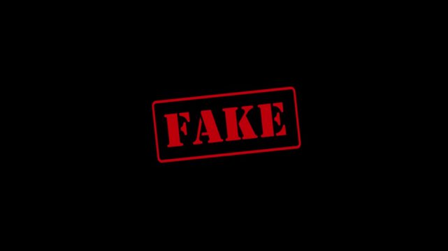 "Fake" stamp animation on a black background; concept of imitation, counterfeit, or inauthentic; 4K video.