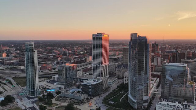Close Aerial View of Milwaukee Downtown Skyscrapers at Sunset&rdquo; Close aerial view of downtown Milwaukee, Wisconsin skyscrapers at sunset, with warm light illuminating one high-rise tower 