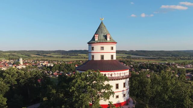 Aerial view of Humprecht Castle surrounded by lush trees and the town of Sobotka in the background under a clear blue sky in Sobotka, Kralovehradecky kraj, Czechia.