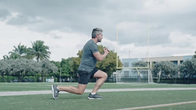 Man sportsman running for exercise. Morning run. Man running at racetrack outdoor. Runner sprinter with incredible speed. Sport runner completing a marathon. Sport training footage