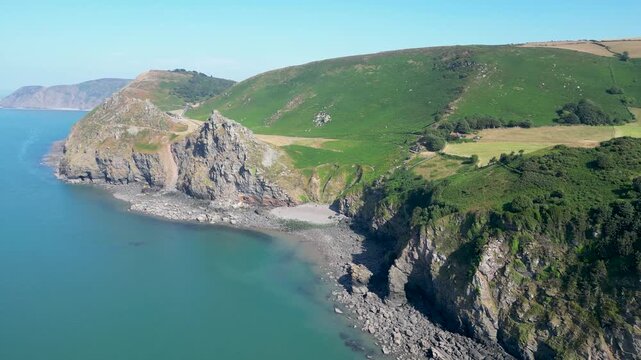 Aerial view of the rugged cliffs and rocky coastline of the Valley of Rocks in Lynton, England, United Kingdom.