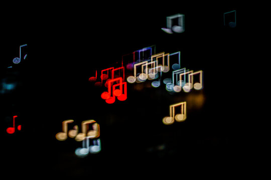 Music Note Bokeh Lights Background on Dark Night