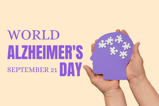Hands hold a purple cutout symbolizing the impact of dementia