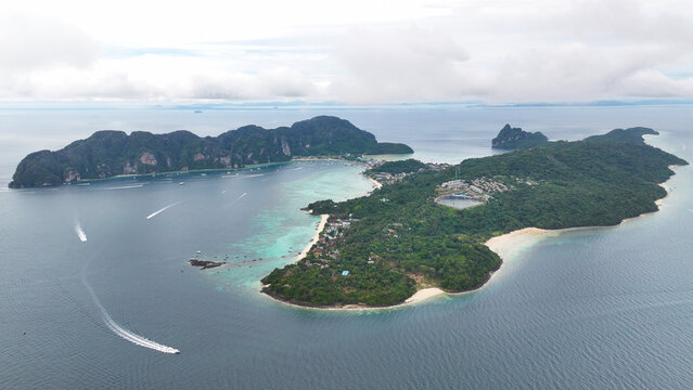Aerial view of Koh Phi Phi with turquoise waters, lush tropical greenery, and sandy beaches in Khlong Phon, Krabi, Thailand.