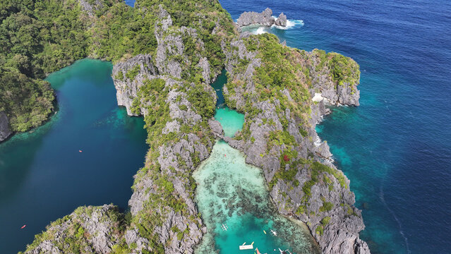 Aerial view of Miniloc Island with its dramatic limestone cliffs, turquoise lagoons, and clear waters in the Bacuit Archipelago Mimaropa, Philippines.