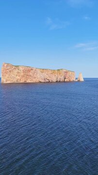 Aerial drone view of Perc&eacute; Rock and rugged coastline in Gasp&eacute;sie, Quebec.
