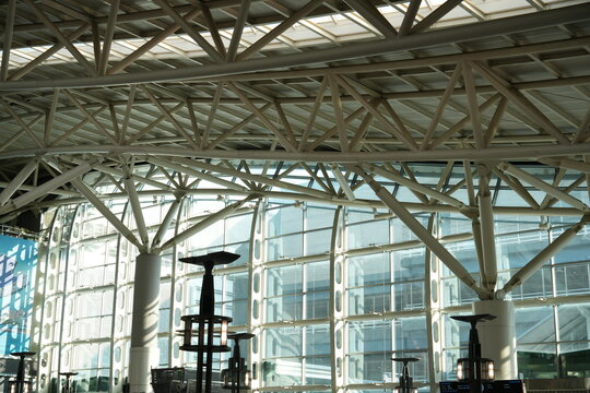 Modern steel frame architecture with large glass curtain wall.