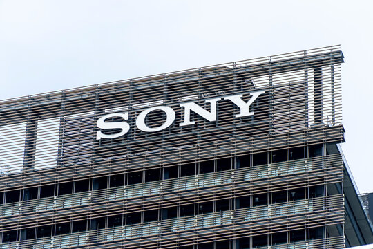 SHINAGAWA, TOKYO, JAPAN - JULY 31, 2026: A low-angle view of the iconic white Sony corporate brand logo sign on a modern high-rise office building wall in Shinagawa-ku, Tokyo.