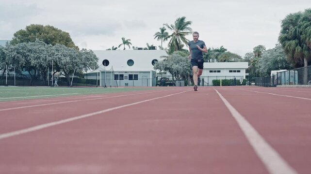 Sport run. Adult man running. Sportsman jogger running. Man sportsman running for exercise. Sport athlete man run. Runner at stadium sport run. Sportsman runner running outdoor. Energetic morning