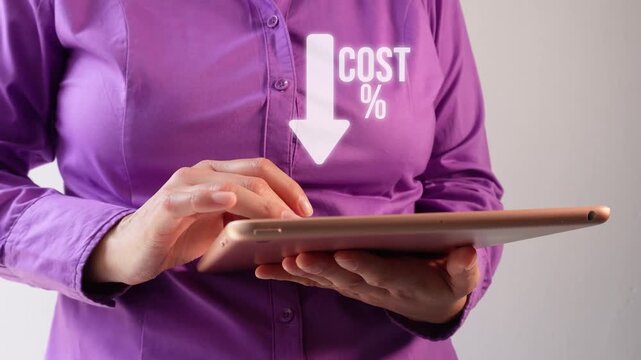 Businesswoman uses tablet to show cost decrease