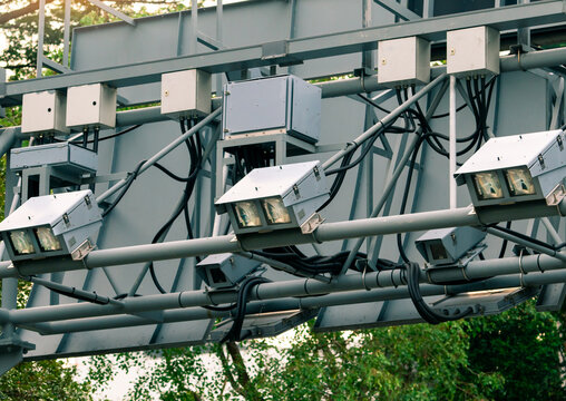 Electronic Road Pricing gantry with smart traffic monitoring equipment above highway. Intelligent transportation technology, automated toll collection and urban mobility infrastructure in Singapore.