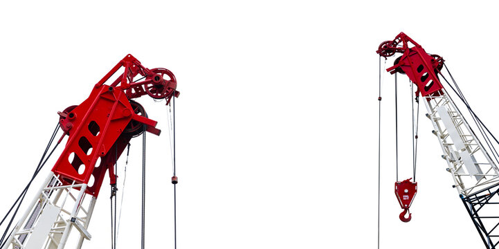 Construction crane for heavy lifting isolated on white background. Construction industry. Closeup red-white crane for lift equipment. Crane for rent. Crane dealership for construction business.
