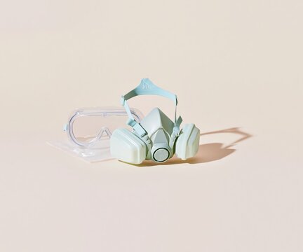 Elastomeric respirator with replaceable filter cartridges and clear safety goggles on a sterile pouch for epidemic preparedness and healthcare safety