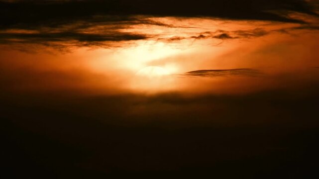 Peaceful sunset time-lapse with warm golden light and fast-moving clouds.
