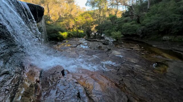 Waterfall Flowing Over Rocky Ledge at Wentworth Falls Australia