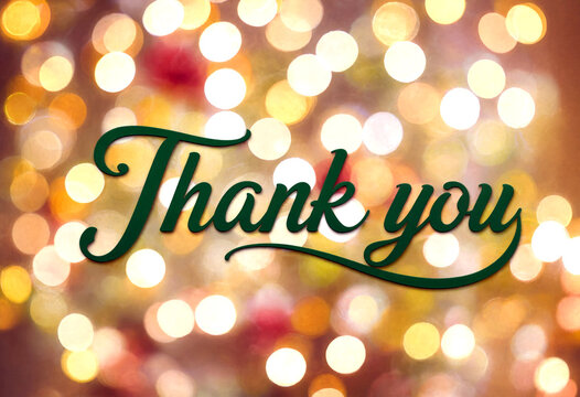 Beautiful thank you message in elegant cursive font with bokeh lights background perfect for celebrations