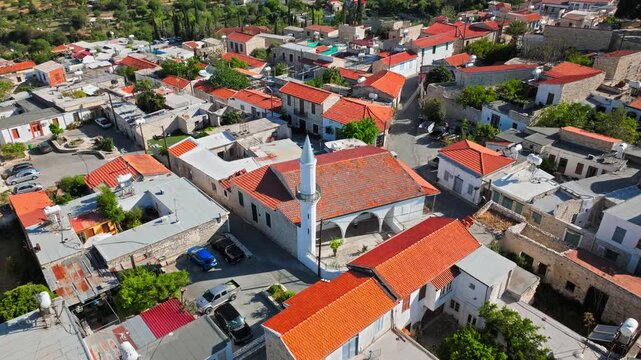 Aerial view over Pano Lefkara in Cyprus. Red roofs, traditional houses and narrow streets show the charm of this historic mountain village.
