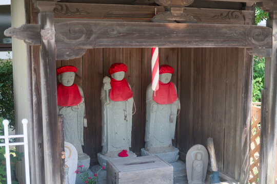Roadside Jizo Shrine With Offering Box And Flowers