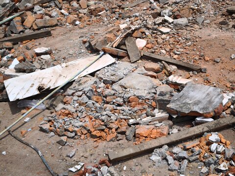 Rubble and debris from a demolished building site during daytime