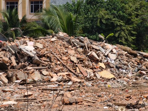 Pile of construction debris and broken bricks at a demolition site