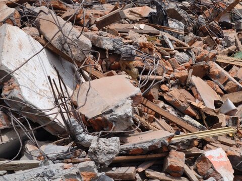 Rubble and twisted metal rebar at a construction demolition site