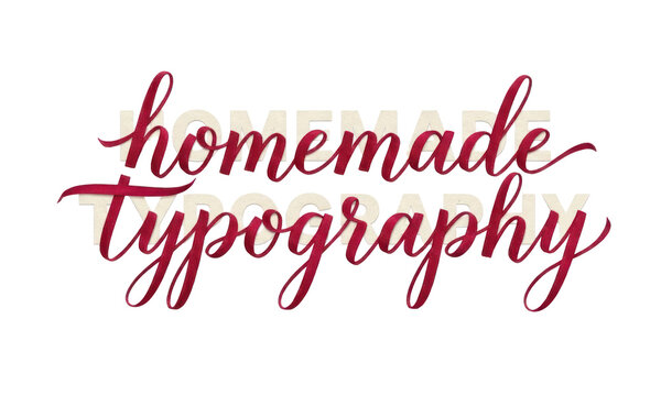 Homemade Typography layered pink and white text.
