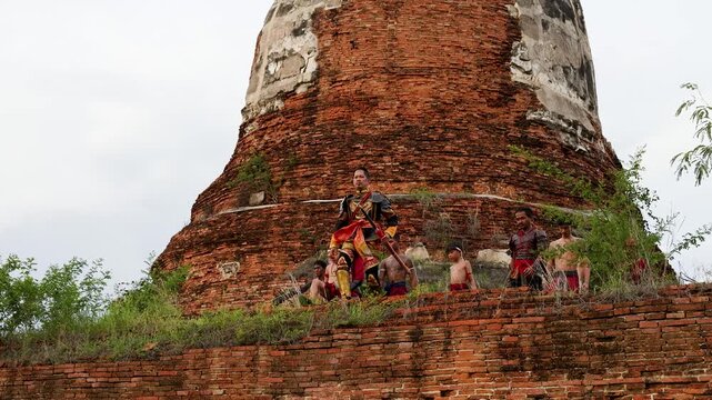 Ancient Thai Warriors in Traditional Armor Standing at Historical Temple Ruins