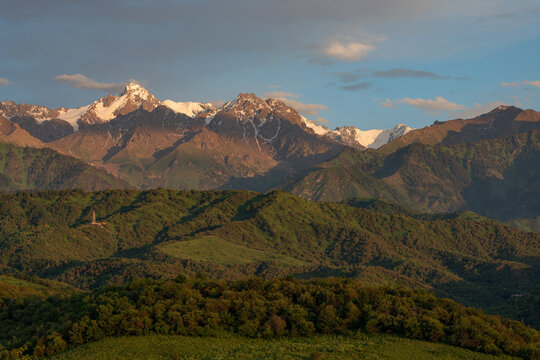The picturesque mountain range of the Trans-Ili Alatau near the Kazakh city of Almaty on a summer evening.