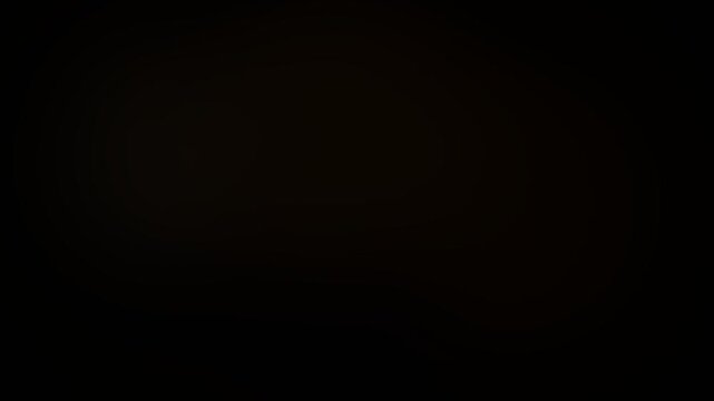 Golden light diffusion creates a soft glowing atmosphere in this abstract video motion background featuring smooth gradients and warm amber tones blended seamlessly to provide a beautiful high quality