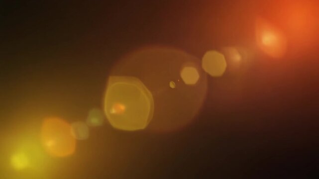 Warm golden sunset light leak flows across dark space with honey gold, amber and soft peach gradients, cinematic sun glow, optical bloom and atmospheric diffusion for premium video overlays.