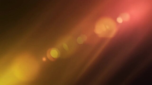 Warm golden sunset light leak flows across dark space with honey gold, amber and soft peach gradients, cinematic sun glow, optical bloom and atmospheric diffusion for premium video overlays.